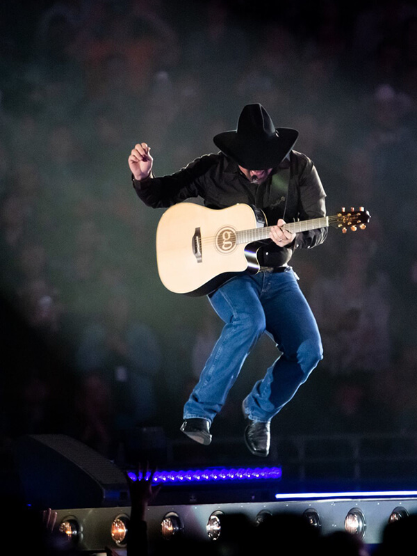 Garth Brooks playing on stage